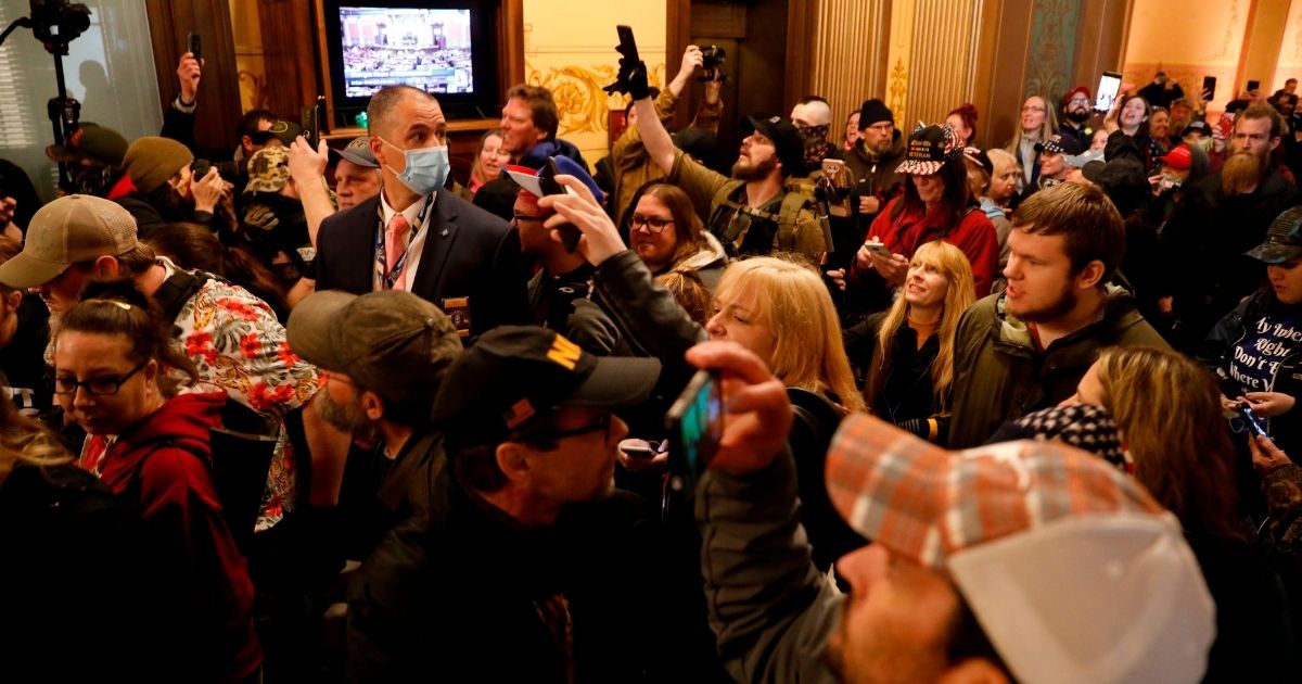 Protesters try to enter the Michigan House of Representatives chamber in Lansing on April 30, 2020.