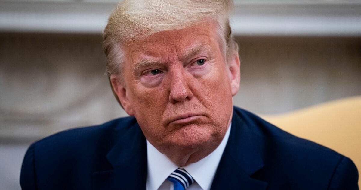 President Donald Trump answers questions during a meeting in the Oval Office of the White House on April 28, 2020.