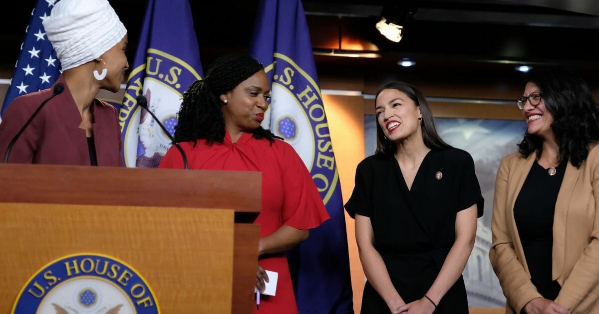 The so-called squad of Democratic congresswomen -- from left, Ilhan Omar of Minnesota, Ayanna Pressley of Massachusetts, Alexandria Ocasio-Cortez of New York and Rashida Tlaib of Michigan -- hold a news conference at the U.S. Capitol in Washington on July 15, 2019.