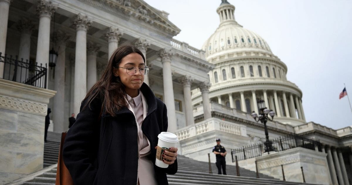 Democratic Rep. Alexandria Ocasio-Cortez of New York leaves the U.S. Capitol after passage of the CARES Act on March 27, 2020.