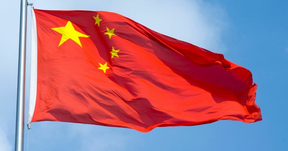 The Chinese flag flaps in the wind on Aug. 5, 2010, in Shanghai.