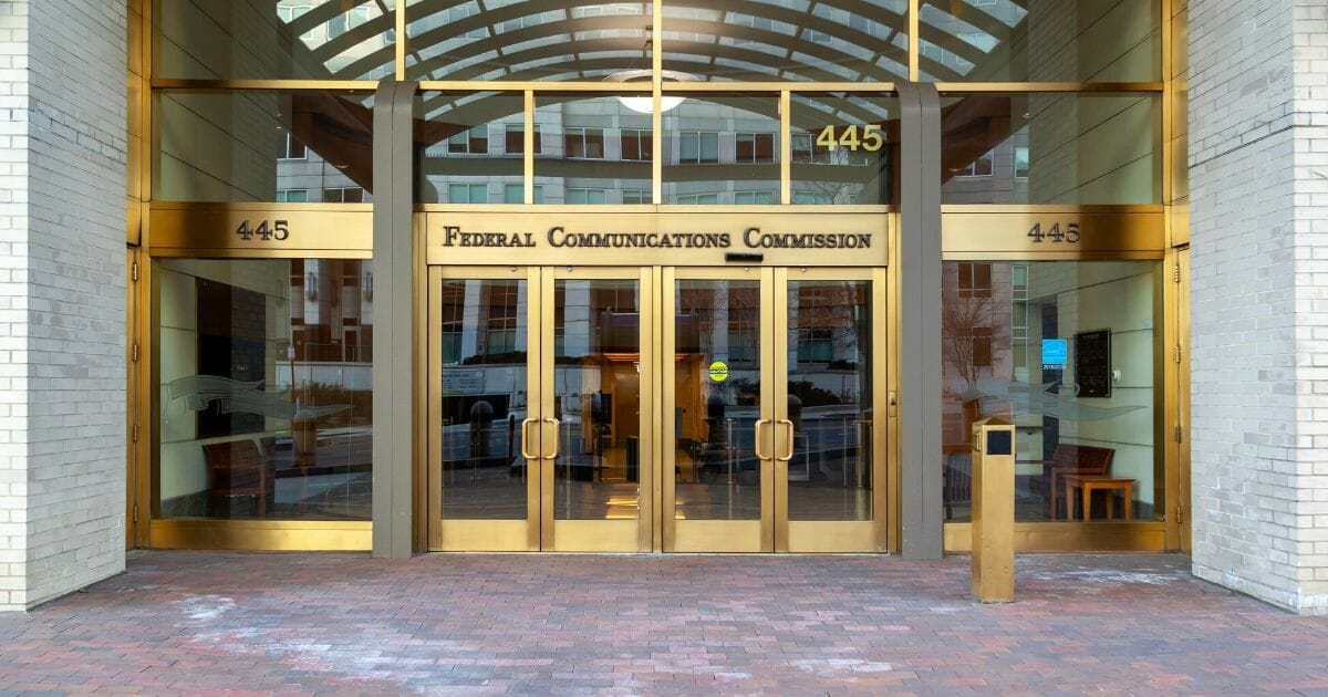 Stock image of the entrance to the building housing the Federal Communications Commission in Washington, D.C.