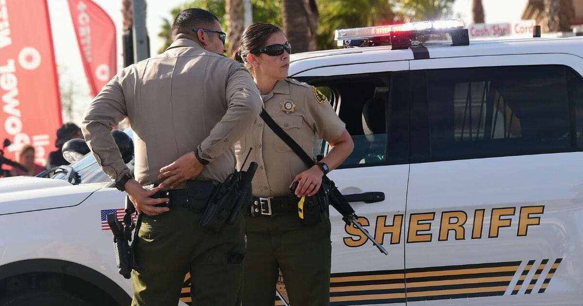 Armed officers from the San Bernardino County Sheriff’s Department on patrol near the scene of the crime in San Bernardino, California, on Dec. 2, 2015.