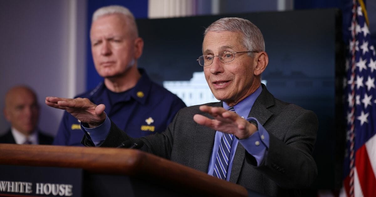 Dr. Anthony Fauci, director of the National Institute of Allergy and Infectious Diseases, addresses a media briefing Monday at the White House.