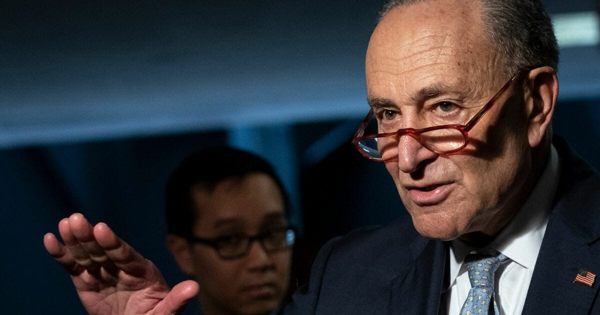 Senate Minority Leader Chuck Schumer speaks to reporters before a meeting with a select group of Senate Republicans, Senate Democrats and Trump administration officials in the Hart Senate Office Building on Capitol Hill on March 20, 2020.