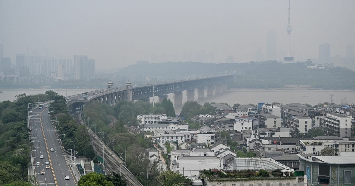 A view of the Wuhan Bridge, center, and the Tortoise Mountain TV Tower, right, from Yellow Crane Tower in the city of Wuhan in China’s central Hubei province on April 10, 2020.