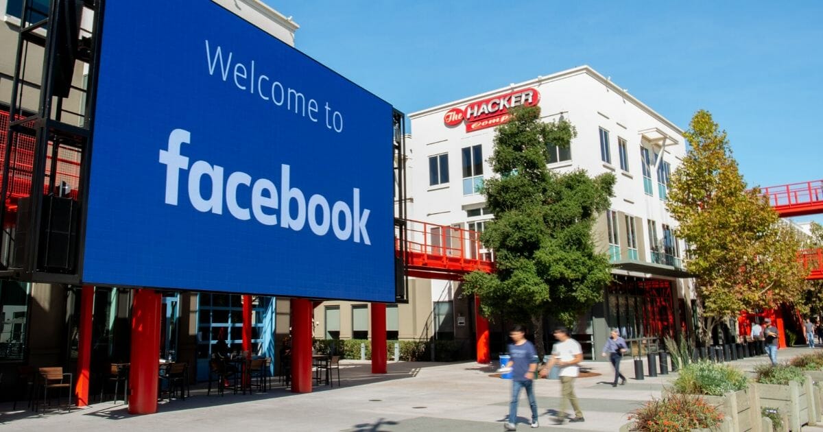 A giant digital sign is seen at Facebook’s corporate headquarters campus in Menlo Park, California, on Oct. 23, 2019.