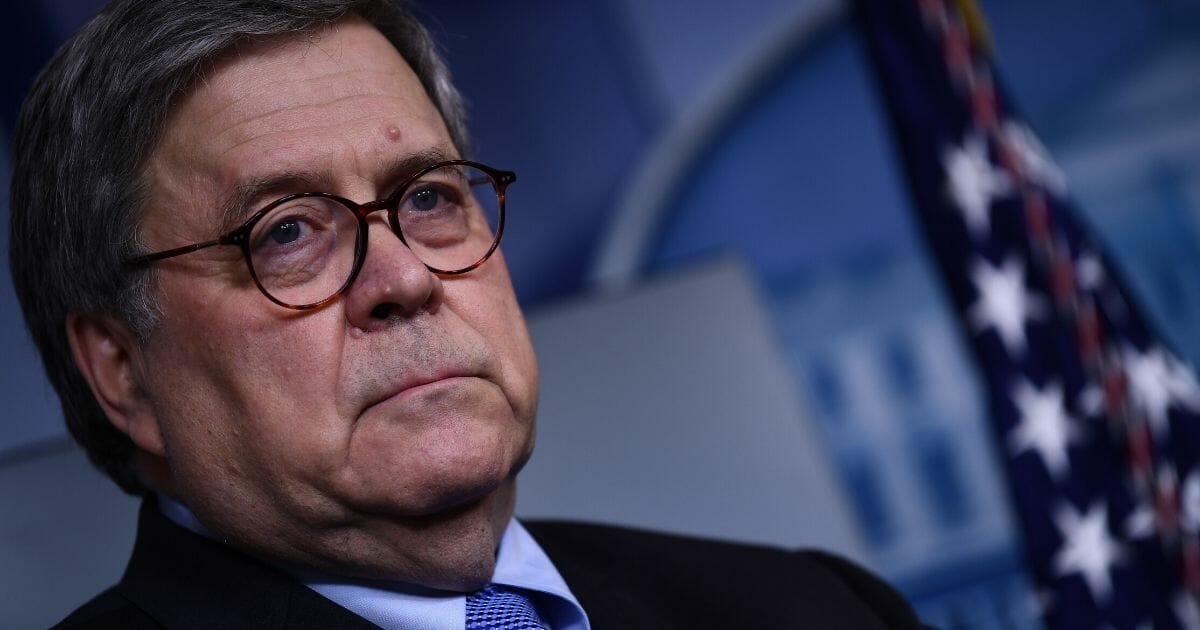 Attorney General William Barr waits in the media briefing room of the White House on March 23, 2020, in Washington, D.C.