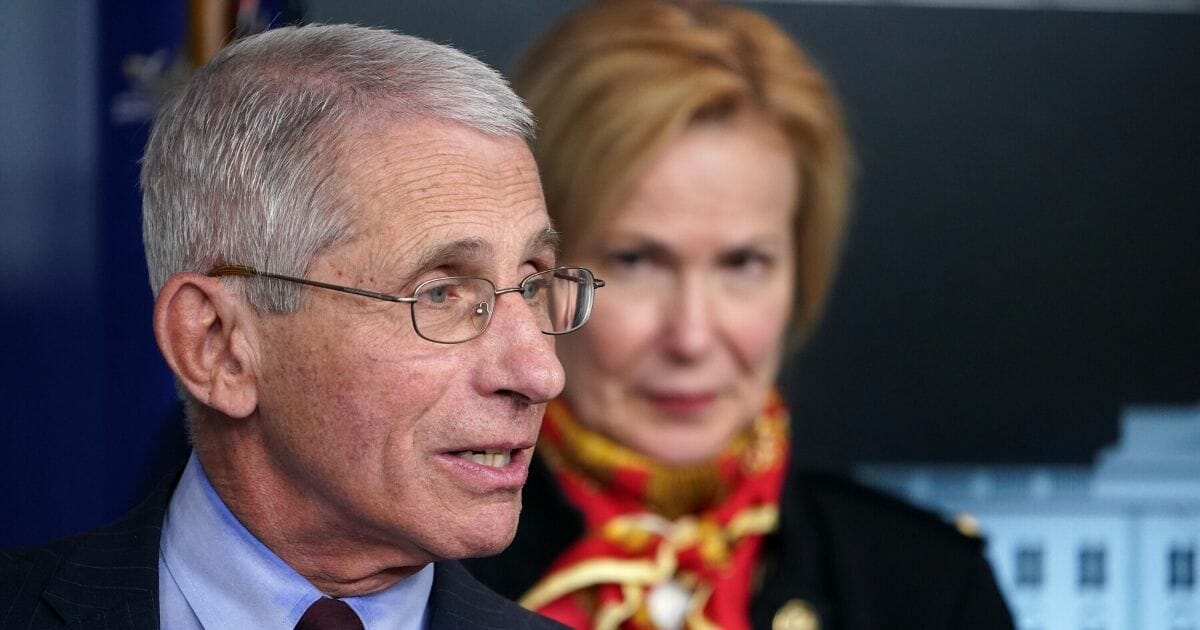 Dr. Anthony Fauci, the director of the National Institute of Allergy and Infectious Diseases, speaks as Dr. Deborah Birx, the response coordinator for White House Coronavirus Task Force, looks on during the daily briefing on the coronavirus at the White House on March 31, 2020.