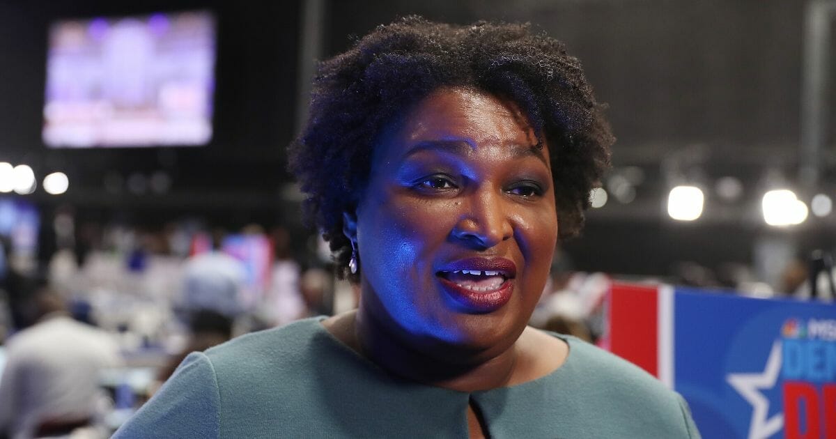 Failed Georgia gubernatorial candidate Stacey Abrams speaks to the media before a Democratic presidential debate at Tyler Perry Studios on Nov. 20, 2019, in Atlanta.