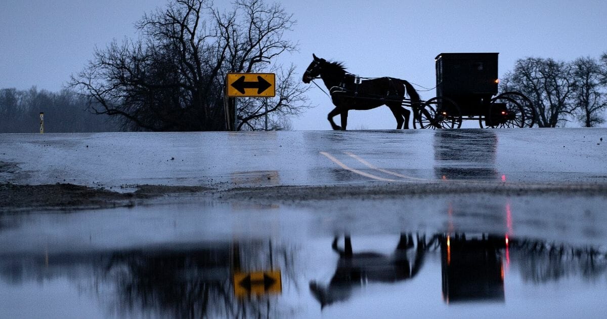 An Amish buggy passes through Middlebury, Indiana, on Jan. 24, 2020.