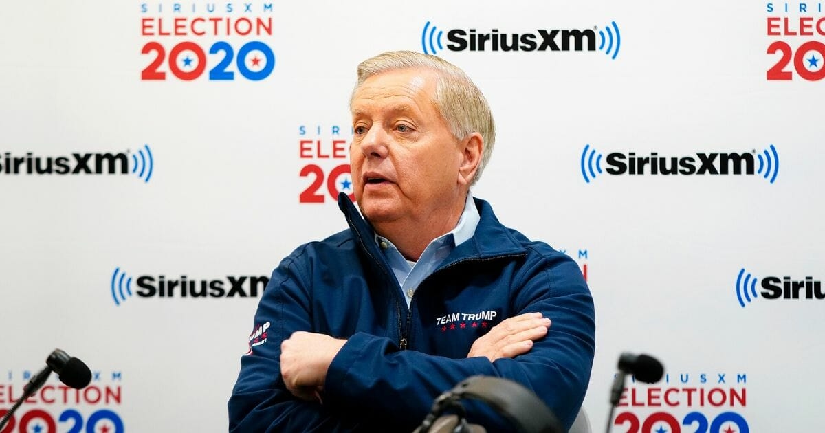 Republican Sen. Lindsey Graham of South Carolina looks on while talking about the 2020 New Hampshire Democratic primary with Sirius XM host Tim Farley on Feb. 11, 2020, in Manchester, New Hampshire.