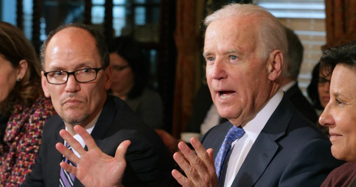 Then-Labor Secretary Tom Perez is pictured with then-Vice President Joe Biden during a cabinet meeting in 2014.