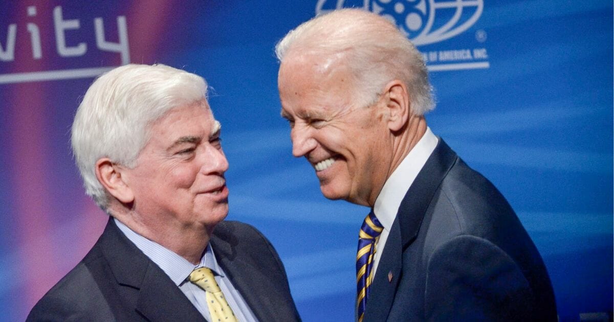 Former Sen. Chris Dodd shares a laugh with then-Vice President Joe Biden at the Newsuem, the now-closed museum of journalism in Washington, in 2014.