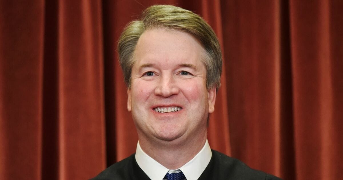 Supreme Court Justice Brett Kavanaugh poses in the official group photo at the Supreme Court in Washington, D.C. on Nov. 30, 2018.