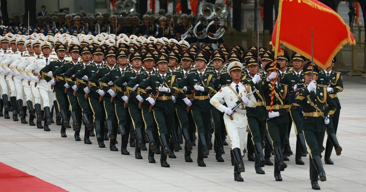 The Guard of Honour of the People's Liberation Army walks in front of Chinese President Xi Jinping and Kazakh President Kassym Jomart Tokayev (not pictured) on Sept. 11, 2019, at the Great Hall of the People in Beijing.