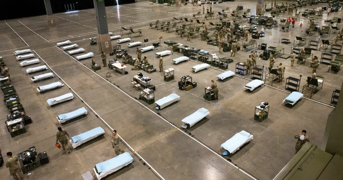 Military personnel set up the 627th Hospital Center field hospital at CenturyLink Event Center on March 31, 2020, in Seattle, Washington.