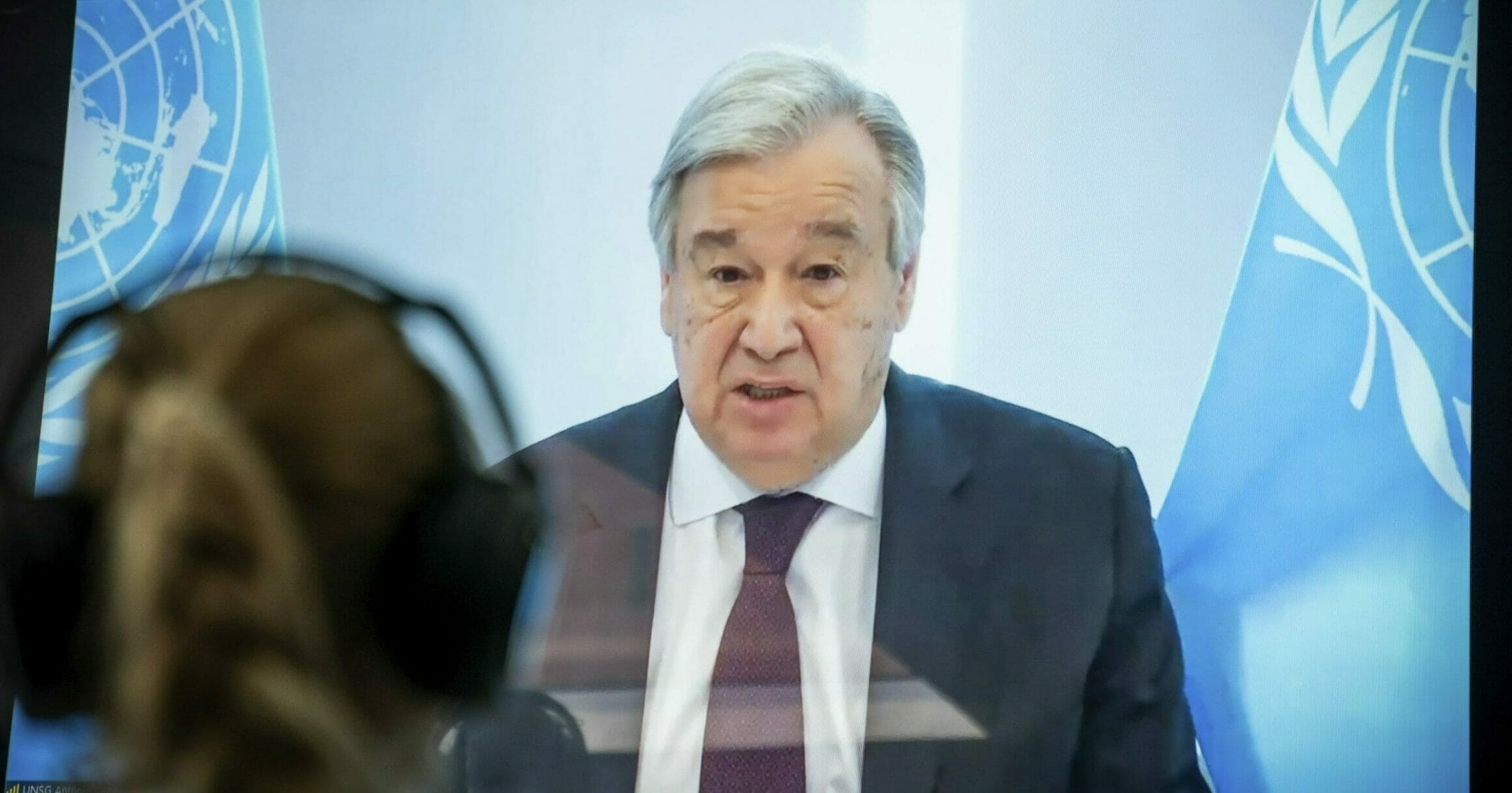 U.N. Secretary-General Antonio Guterres is displayed on a screen as he delivers a speech at the Petersberg Climate Dialogue in Berlin on April 28, 2020.