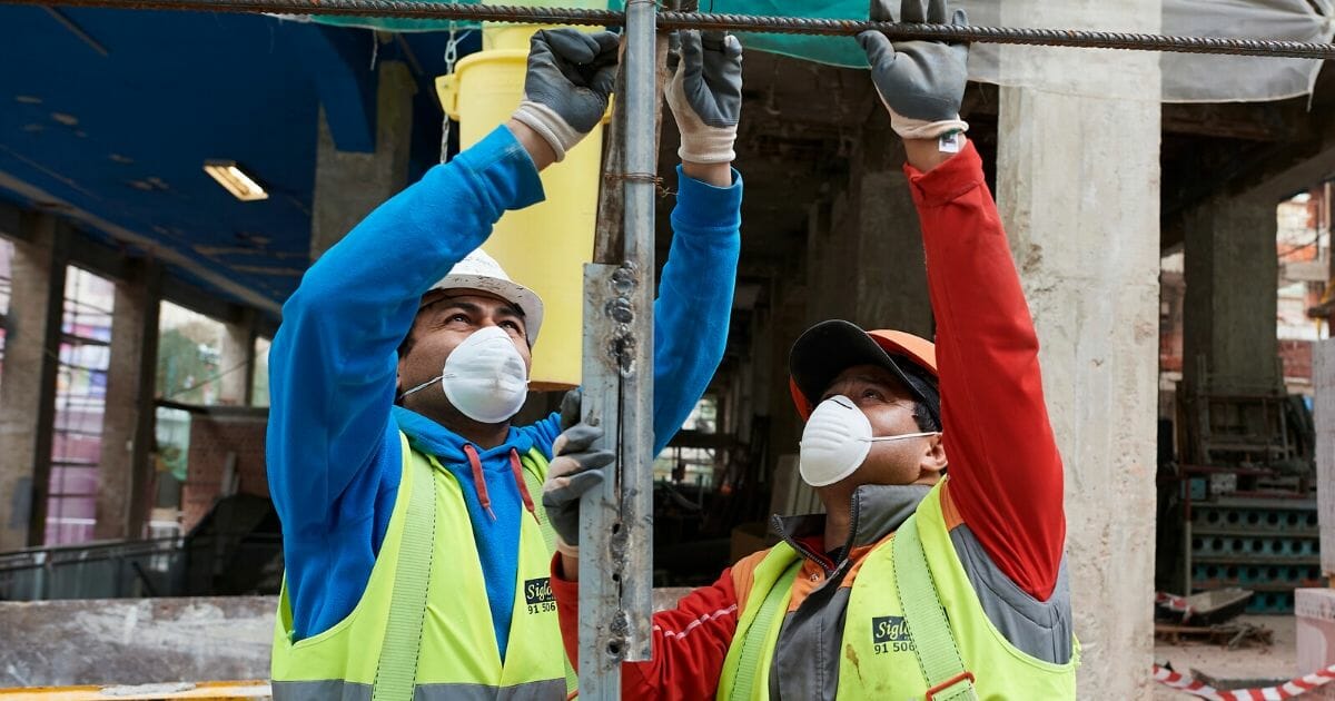 Construction workers return to work as the government ease the coronavirus work restrictions on April 14, 2020, in Madrid, Spain.
