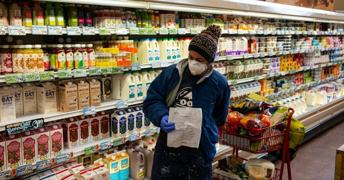 grocery store shopper in surgical mask