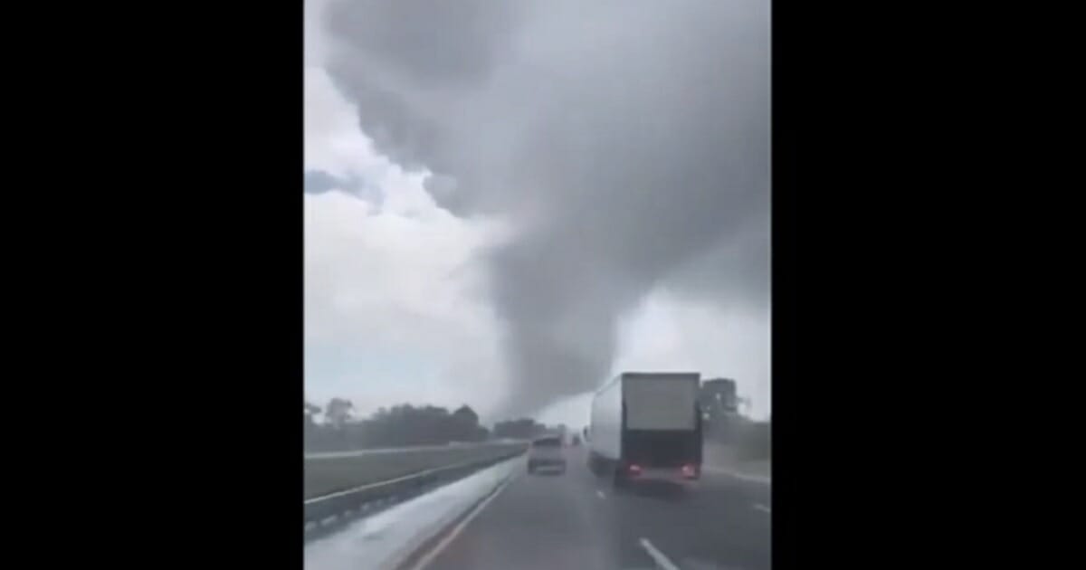 A tornado is seen from a vehicle on Interstate 75 in Florida.