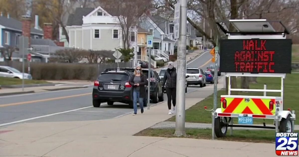 electronic one-way sidewalk sign in Beverly, Massachusetts