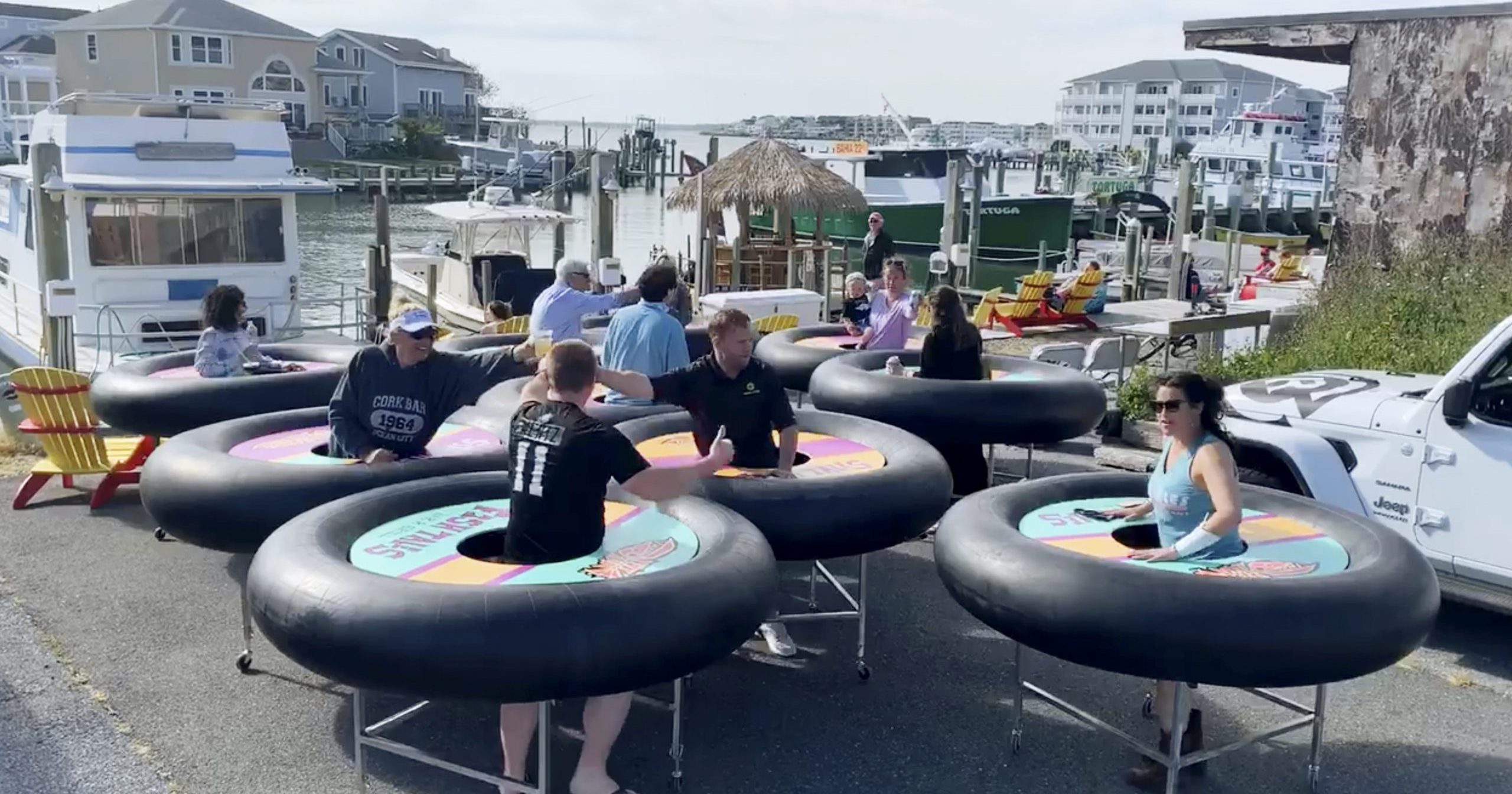 "Bumper tables," designed to allow people to practice social distancing while eating and talking, make their debut at Fish Tales restaurant in Ocean City, Maryland, on May 16, 2020.