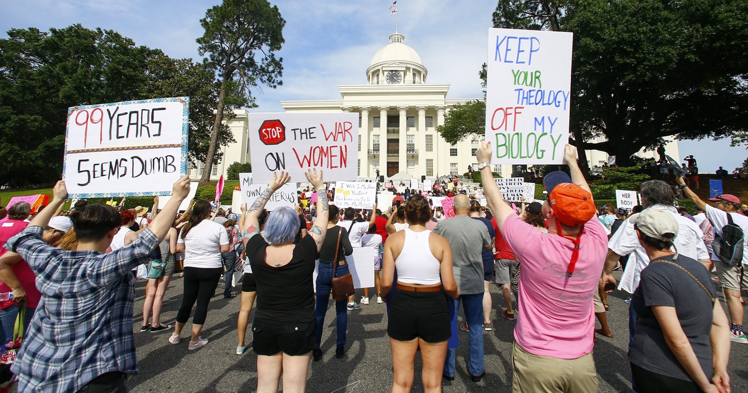 In this May 19, 2019, file photo, protesters for abortion rights hold a rally on the Alabama Capitol steps to protest a law passed the previous week making abortion a felony in nearly all cases with no exceptions for cases of rape or incest, in Montgomery, Alabama.