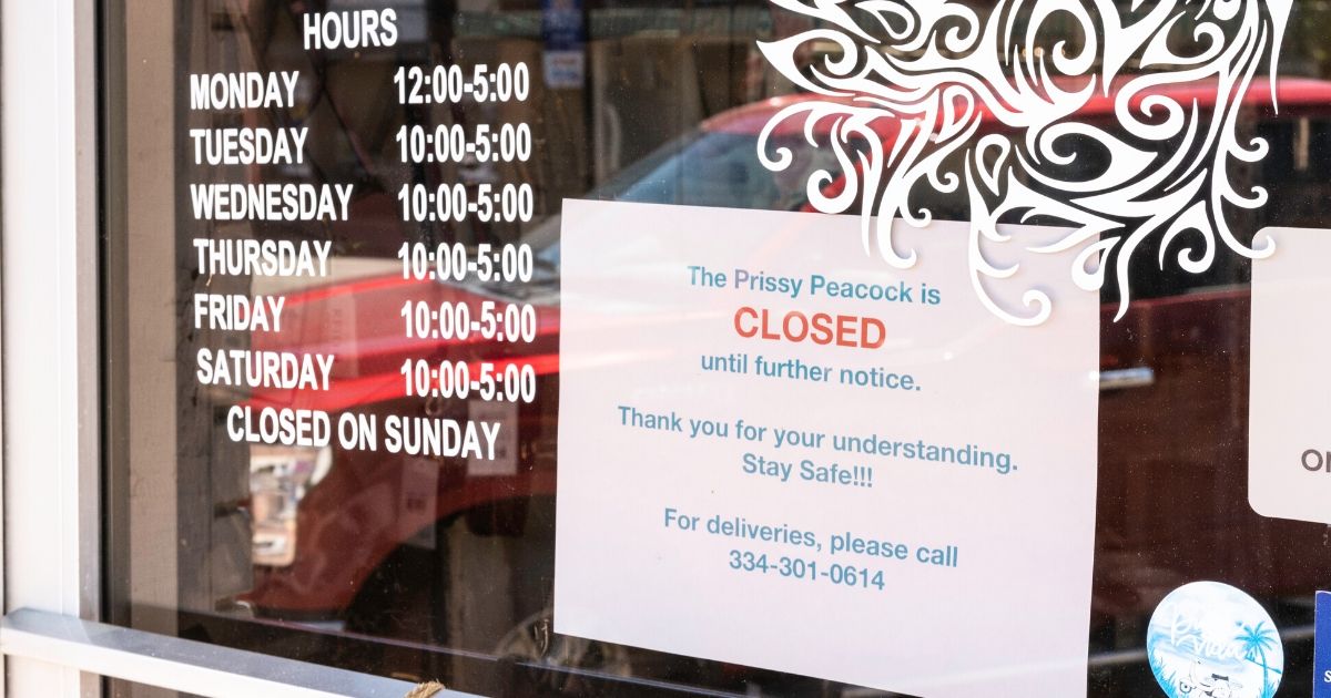 A closed sign is seen on a small business in downtown Prattville, Alabama, on April 15, 2020.