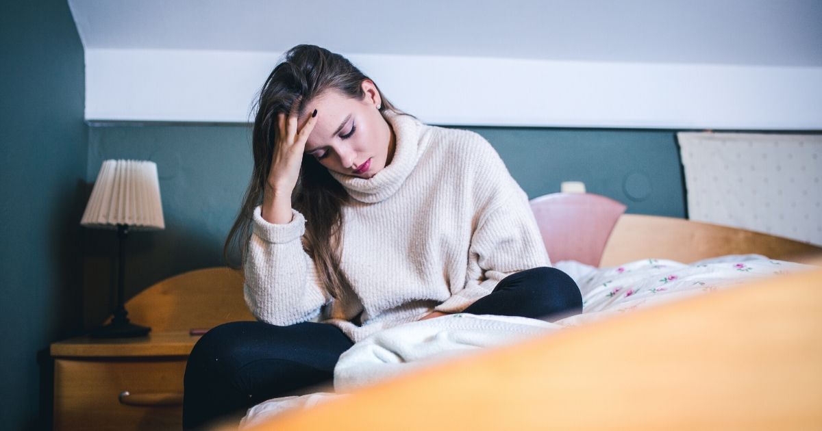 A depressed woman is seen in the stock image above.