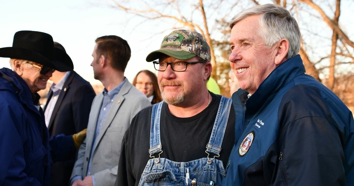 Missouri Gov. Mike Parson with some rural constituents in 2019.