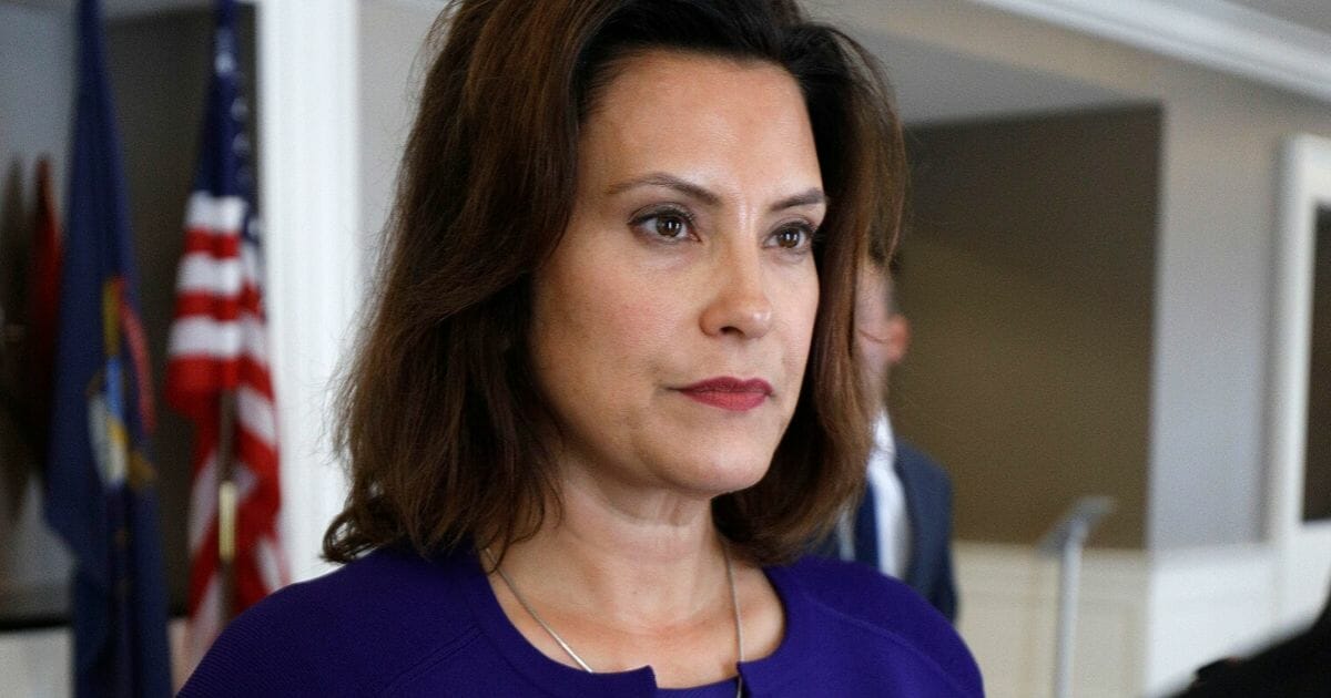 Gretchen Whitmer speaks with a reporter at the Westin Book Cadillac Hotel in Detroit on Aug. 8, 2018.