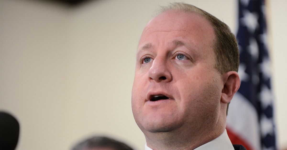 Colorado Goc. Jared Polis speaks to the media at the Douglas County Sheriffs Office Highlands Ranch Substation on May 8, 2019, in Highlands Ranch, Colorado.