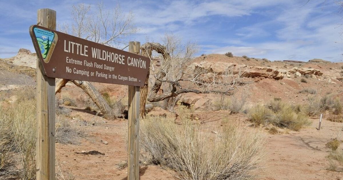 A 7-year-old girl has died and her 3-year-old sister is missing after flash flooding sent torrents of water into a narrow canyon in the Utah desert, authorities said Tuesday.