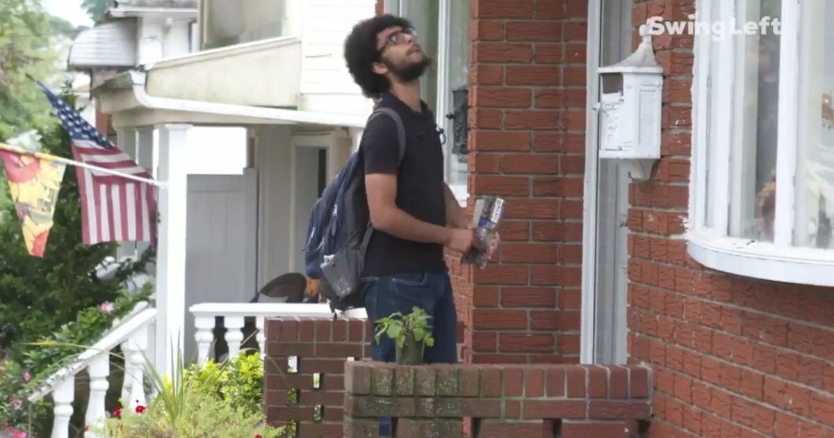 A Swing Left volunteer knocks on doors to try to get Democratic candidates elected.