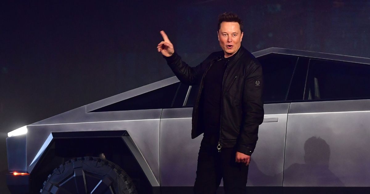 Tesla co-founder and CEO Elon Musk in front of the new Telsa Cybertruck