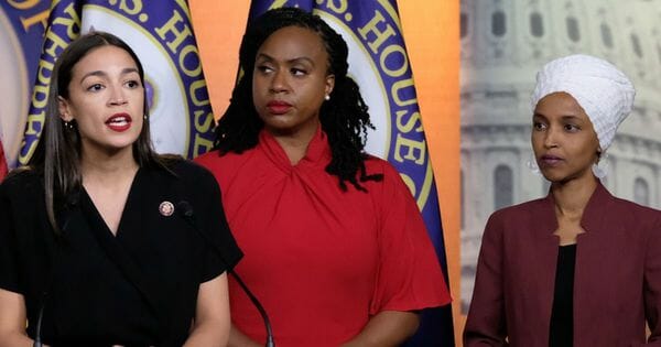 Democratic Rep. Alexandria Ocasio-Cortez of New York, left, speaks as Reps. Ayanna Pressley of Massachusetts, center, and Ilhan Omar of Minnesota listen during a news conference at the U.S. Capitol on July 15, 2019, in Washington, D.C.