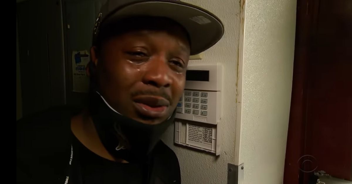 Small business owner K.B. Balla weeps over his business, destroyed during this week's Minneapolis riots.