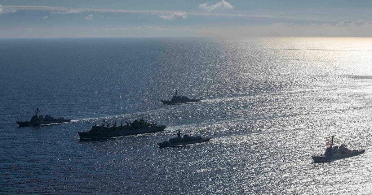One British and three American ships conduct a photo exercise while conducting joint operations to ensure maritime security in the Arctic Ocean on May 5, 2020.