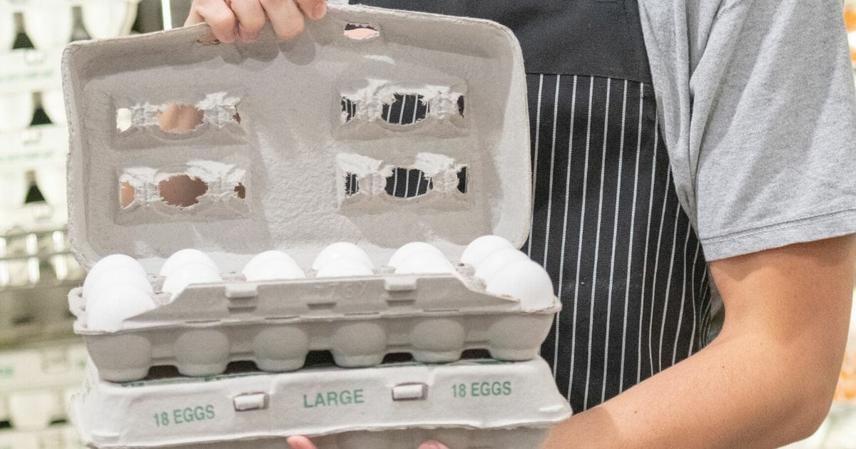 Open carton of supermarket eggs.