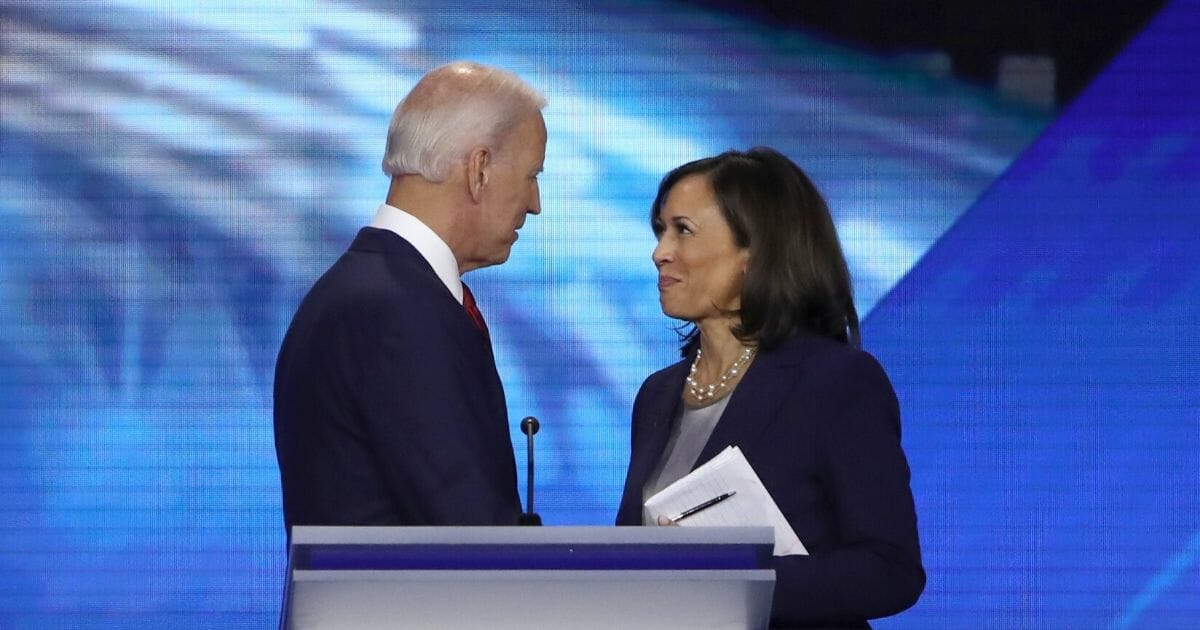 Former Vice President Joe Biden and California Sen. Kamala Harris share a moment after the Sept. 12 Democratic presidential primary debate in Houston.