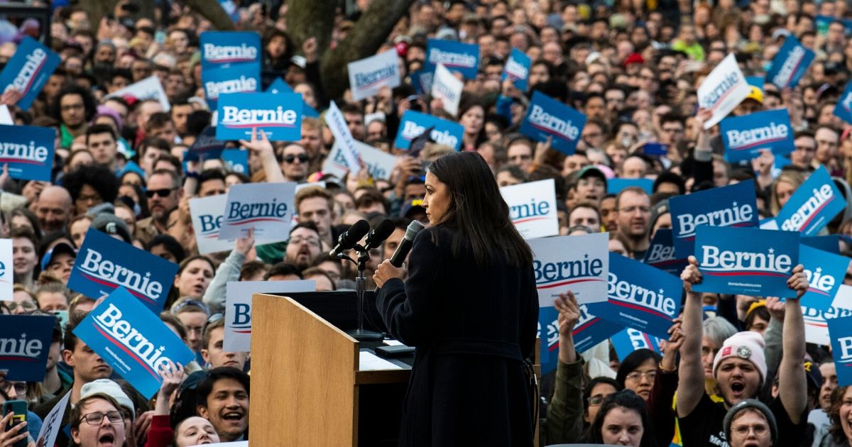 Democratic Rep. Alexandria Ocasio-Cortez of New York addresses supporters during a campaign rally for Democratic Sen. Bernie Sanders of Vermont, then a presidential candidate, on March 8, 2020, in Ann Arbor, Michigan.
