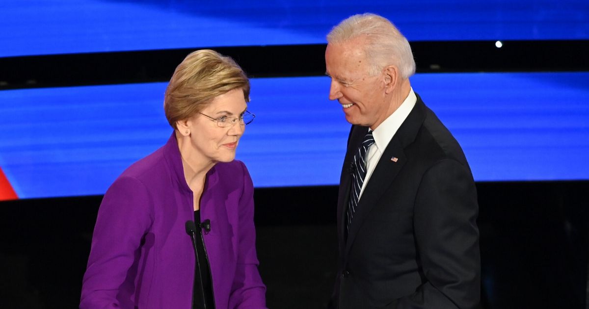 Massachusetts Sen. Elizabeth Warren shares a jovial moment with former Vice President Joe Biden during the January Democratic presidential primary debate in Des Moines, Iowa.