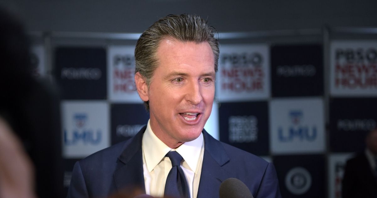 Democratic California Gov. Gavin Newsom speaks to the media in the spin room after the sixth Democratic primary debate of the 2020 presidential campaign season co-hosted by PBS NewsHour & Politico at Loyola Marymount University in Los Angeles on Dec. 19, 2019.