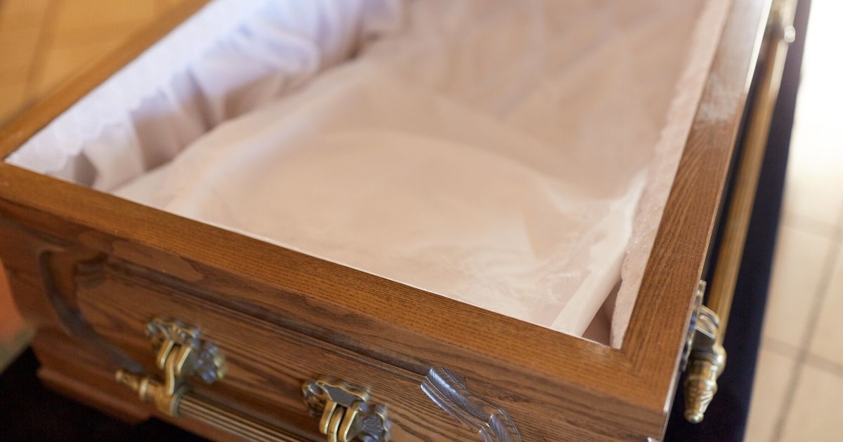 Stock image of an open coffin.