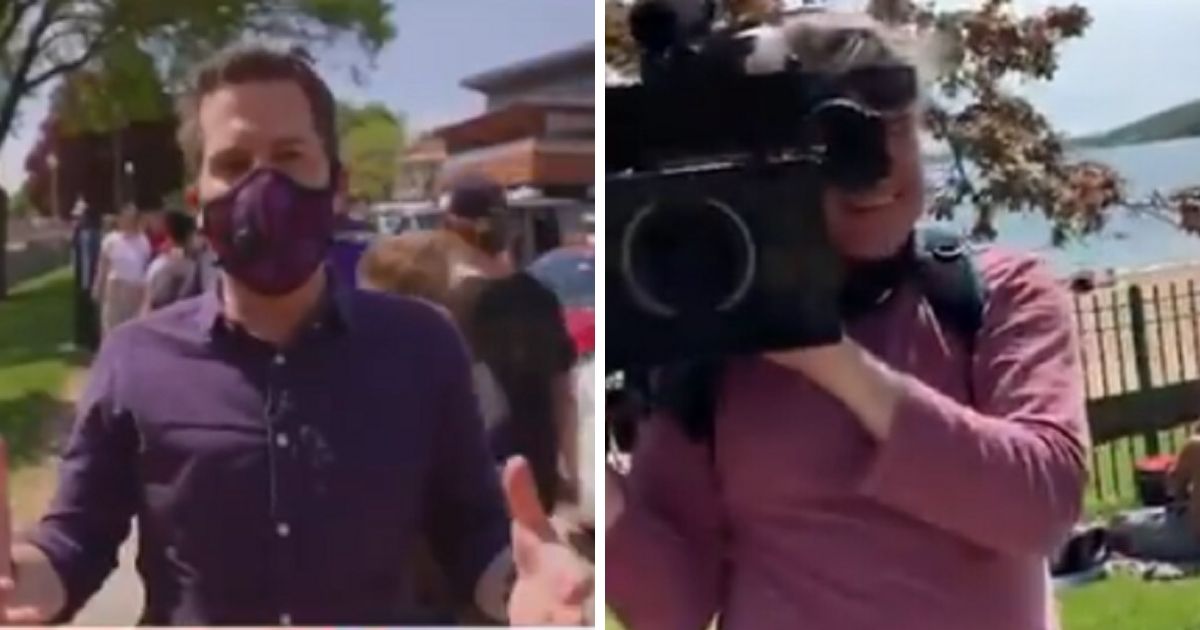 MSNBC's Cal Perry, right, with a mask. MSNBC's cameraman, left, without a mask.