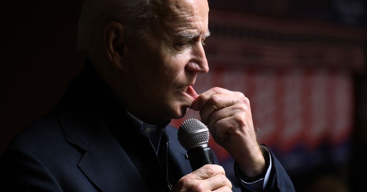Former Vice President Joe Biden, now the presumptive Democratic presidential nominee, talks to campaign volunteers during a stop at Jeno's Little Hungary on Jan. 28, 2020, in Davenport, Iowa.