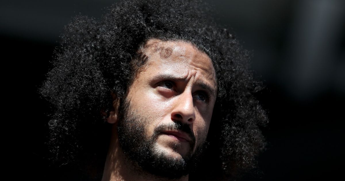 Former NFL quarterback Colin Kaepernick watches a Women's Singles second round match between Naomi Osaka of Japan and Magda Linette of Poland on day four of the 2019 US Open at the USTA Billie Jean King National Tennis Center on Aug. 29, 2019, in the Queens borough of New York City.