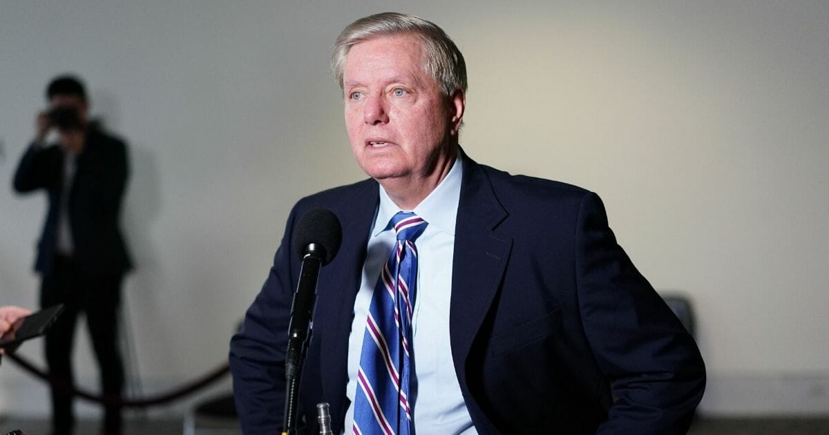 Republican Sen. Lindsey Graham of South Carolina speaks to reporters as he arrives for the Republican policy luncheon at the Hart Senate Office Building in Washington, D.C., on March 19, 2020.