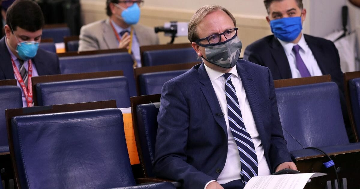 ABC News' Jonathan Karl wears a face mask to reduce the risk of spreading the coronavirus during a news conference in the Brady Press Briefing Room at the White House on May 8, 2020, in Washington, D.C.